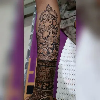 A beautifully detailed portrait of Lord Ganesha, the remover of obstacles. This design is perfect for bringing blessings to a new beginning, like a wedding or festival.