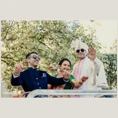 The groom's arrival in an open-top vehicle, full of smiles and energy. We capture the groom's happiness and style as he makes his way to the ceremony.