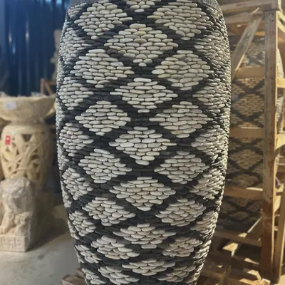 This majestic 4-foot tall pebble planter is a true work of art. Each pebble is carefully placed by Balinese artisans to create this stunning diamond pattern.