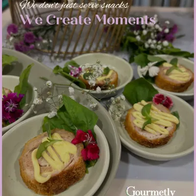 We don’t just serve snacks; we create moments. These individually plated appetizers, garnished with fresh basil and edible flowers, are designed to be as beautiful as they are delicious.