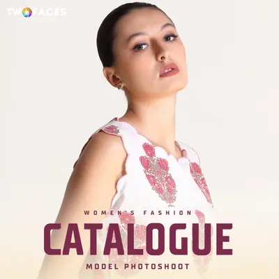 A strong, high-fashion pose from a model in a white printed top, perfect for a catalogue or portfolio headshot.