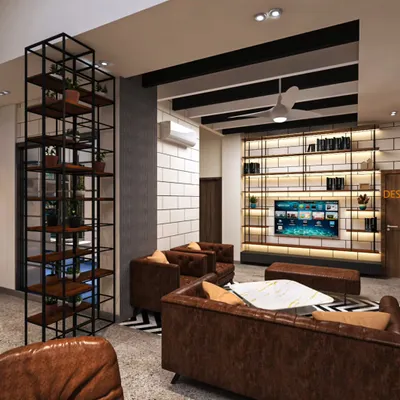 This lounge area combines industrial and modern elements for a comfortable yet stylish feel. We used open-frame metal shelving, a textured brick-pattern wall, and classic leather armchairs to create a space that is perfect for relaxation and conversation.