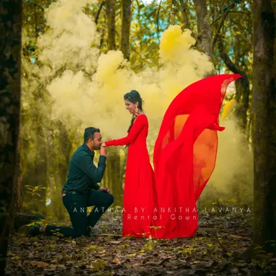 A romantic moment from a pre-wedding shoot, enhanced by the vibrant red of my rental gown and a dramatic smoke effect. This gown is designed to make a statement in any setting.