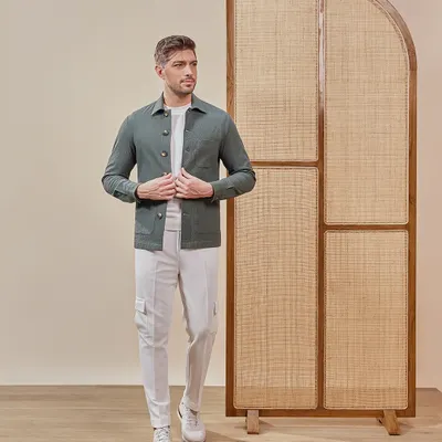 This olive green shacket is the perfect piece for a chill dinner or casual outing. I designed it to be an effortless layer that instantly elevates any look with its rich color and texture.
