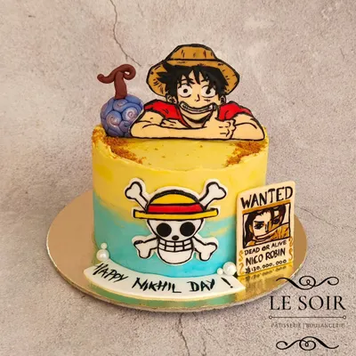 This One Piece cake was a blast to make, even if Luffy's hair was a challenge. This half-kg Cookies & Cream cake features Luffy, the Jolly Roger, a Devil Fruit, and a wanted poster, all hand-crafted.