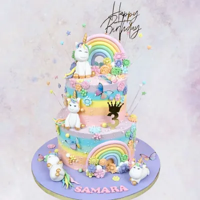 A magical two-tier unicorn cake for Samara's 3rd birthday. With pastel rainbows, fluffy clouds, and adorable unicorns, this cake is what sweet dreams are made of.
