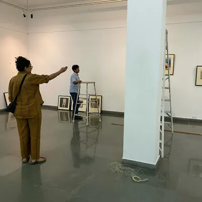 Here is curator Pushpamala N directing the team during the installation of Gulammohammed Sheikh's 'Hand Prints'. The process of curating is hands-on and collaborative.