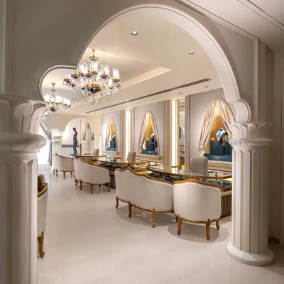 A view through the grand arches of a luxury jewellery store we designed. The space is organized to create private, elegant consultation areas, with plush seating and custom display counters that make the selection process a personal and luxurious affair.