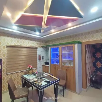 Even a small touch of green can make a difference. In this dining room project, I added a neat artificial grass topper to the wooden crockery unit, tying it in with the room's natural elements.