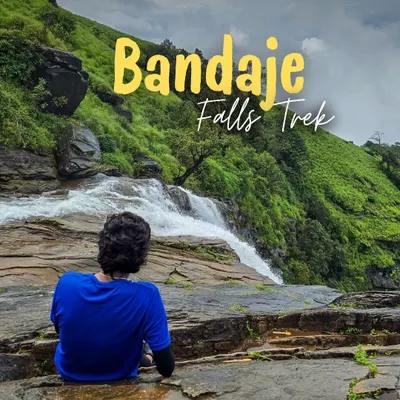 A trekker sits at the edge of the world, right where Bandaje Falls begins its dramatic drop. This is a view that truly takes your breath away.