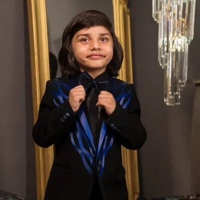 A close up of the blue satin wire detailing on the lapels of this custom tuxedo. I pair it with a matching bow tie to complete this sharp formal wear look.