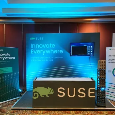 A complete exhibition stall designed for SUSE, featuring back-lit panels, a branded counter, and informational standees. I create functional and visually appealing booths that stand out on a crowded trade show floor.