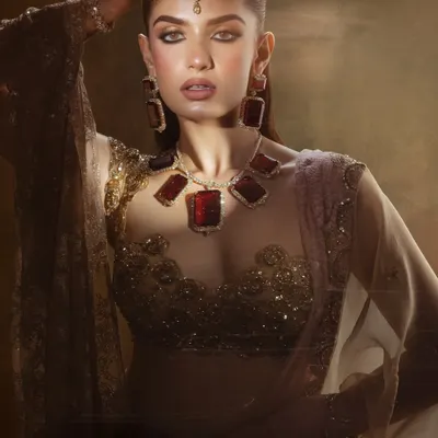 A Dream. This artistic shot from a campaign features a dramatic, smoky eye and bold ruby jewelry for a high fashion look.