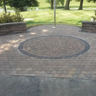 Here is a closer look at a circular paver kit I installed. The contrasting border stone really makes the pattern stand out as a centerpiece for the patio.