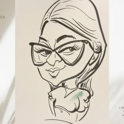 A close-up of a finished black and white sketch. I use bold, confident lines to capture the subject's expression and personality, especially their stylish glasses.