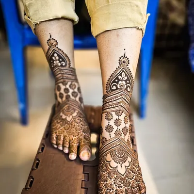 A stunning, full-coverage design for the feet, matching the intricacy of a full bridal henna for the hands.