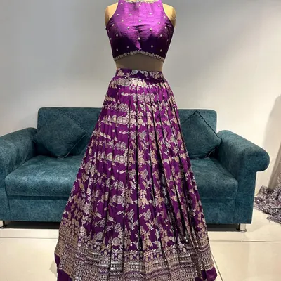 Grace in every pleat, tradition in every thread. This purple Banarasi lehenga is where modern style meets heritage.