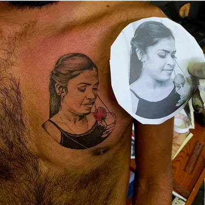The ultimate test of a portrait tattoo is comparing it to the source. This image shows the finished piece next to the reference photo, demonstrating the accuracy in shading and detail needed for a true-to-life portrait.