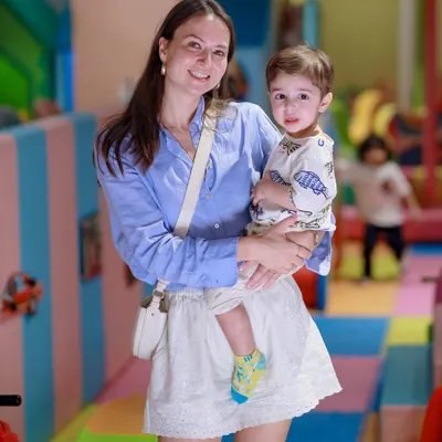 A beautiful moment between a mother and her son. Our play area is a backdrop for creating cherished family memories.