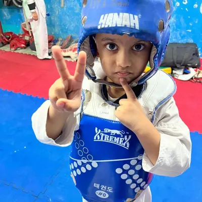 This little warrior is ready to train. We teach kids to be focused and disciplined from their very first day at the academy.