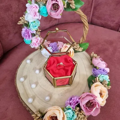 Unveiling timeless elegance with our new engagement ring platter. The floral-adorned wooden platter and glass ring box create a dazzling beginning for any love story.