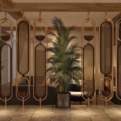This stunning partition is made of metal frames with a powder-coated finish, holding panels of natural cane mesh. It divides the space while allowing light to pass through, adding a touch of organic modernism.