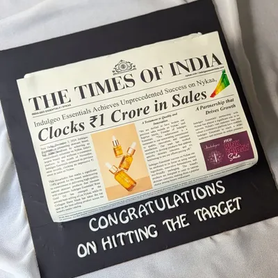 This edible newspaper cake celebrated a ₹1 Crore sales target for Indulgeo Essentials. It's a unique and memorable way to commemorate a huge team win, with every detail designed to look like a real front-page story.
