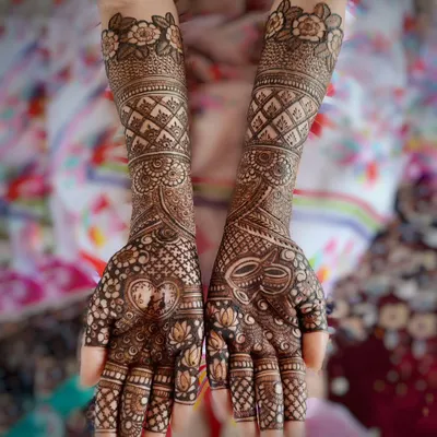 A complete bridal design that combines delicate floral work, traditional jaal patterns, and custom elements like the heart and kalash motifs. This is a perfect example of a full coverage design for the modern bride.