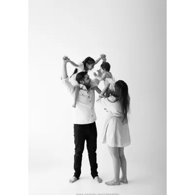 A moment of pure family fun, with little ones lifted high. I aim to capture these dynamic, joyful interactions that show the unique spirit of your family.