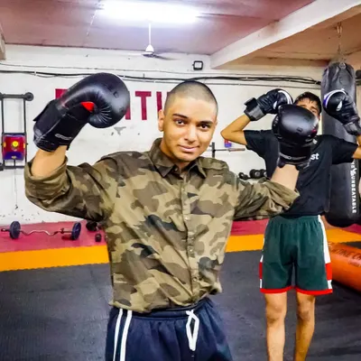 Yes, they are kids, but they are not weak. This young warrior is ready to train, showing the confidence and determination we build in our youth programs.