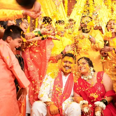 A shower of flower petals and blessings. This is the heart of the Haldi ceremony, a moment of pure joy and celebration that I love to capture.