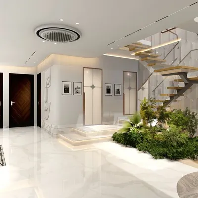 The entrance foyer of this Vasant Vihar residence sets a tone of luxury and biophilic design. A floating staircase rises above an indoor garden, complemented by textured walls and polished marble floors for a grand first impression.
