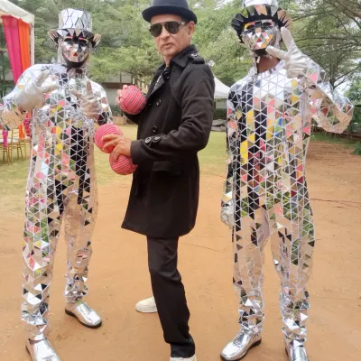 Posing with my incredible Mirror Man artists. Their reflective costumes are visually stunning, especially for evening events or parties with unique lighting, and they make for amazing photos.