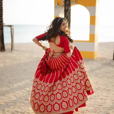 When the sea meets love! A beautiful shot of my Sabyasachi bride twirling on a beach in Thailand.