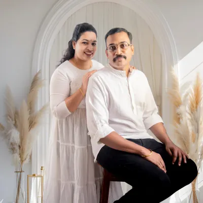 A bright and airy portrait of a couple in our studio. This shot captures a quiet, connected moment between partners.