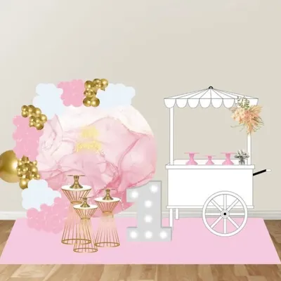 A digital mockup for a first birthday party, showing a pink floral backdrop, a marquee number "1", and a candy cart. This helps you visualize the setup.