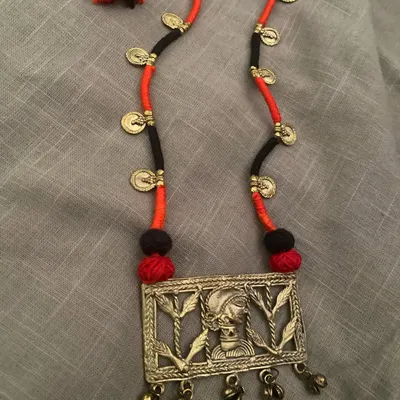 This beautiful Dokhra neckpiece was a collaboration with another artist. I used my collection of cords and beads to assemble this piece, and I love how the final design turned out.