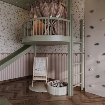 This view highlights the multi-level design of the playroom, featuring a climbing wall for adventurous spirits and a mezzanine fort for quiet moments. The combination of a slide, ball pit, and activity easel creates a layered environment for diverse play.