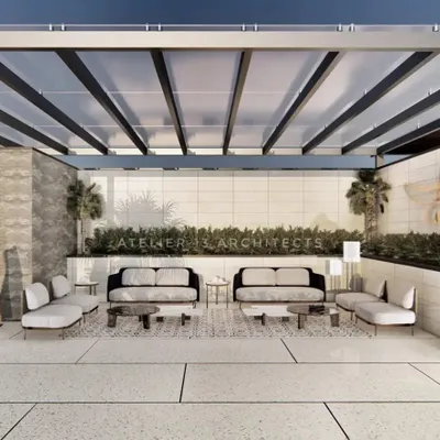 This terrace design for a project in Gurugram redefines minimalism. The space is organized with clean lines, featuring low-profile sofas and a sculptural art piece under a sleek pergola, creating a serene and sophisticated environment for outdoor lounging.
