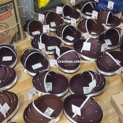 A large order of our unique cradle-shaped hampers. We chose this beautiful brown color as a gender-neutral option for baby showers, and it's become very popular.
