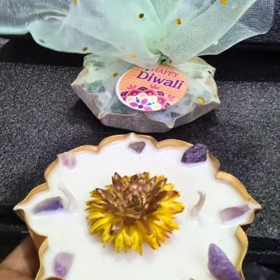 Lighting up hearts this Diwali with handcrafted candles. This gift set includes a beautiful floral urli candle with amethyst crystals, ready to spread positivity and light.