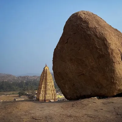A classic Hampi view. Using the massive granite boulder to frame the historic temple shows the interplay between nature and architecture in this UNESCO World Heritage site.
