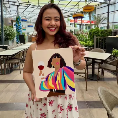 The birthday girl, Nicole Concessao, with her vibrant finished painting. Hosting her paint party was a truly special experience filled with warmth and creativity.