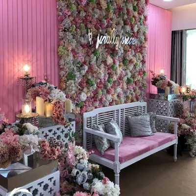This indoor Mehendi was a pastel dream. I designed a floor-to-ceiling flower wall with a custom '#finally' neon sign, paired with elegant white and pink seating for a chic and modern look.