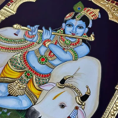Krishna Mana Mohana, Chitha Chora Radha Jeevana. This beautiful finished painting captures Krishna playing his flute, resting beside his beloved cow, under an ornate golden arch.
