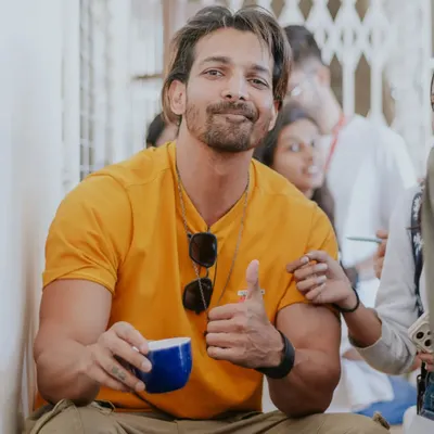 A candid shot of actor Harshvardhan Rane during a relaxed moment. My goal is to capture genuine personality, even with public figures, by creating a comfortable atmosphere.