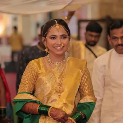 My beautiful Maharashtrian bride Dhanashree, ready for her wedding ceremony. Her golden silk saree with a green shela is a classic and elegant choice.