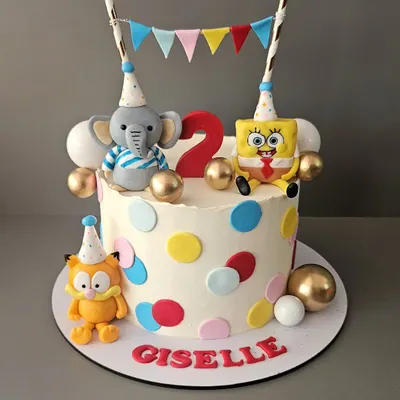 A fun character mashup for Giselle's 2nd birthday. This cake features her favorite fluffy buddies: SpongeBob, Garfield, and a cute elephant, all ready to party.