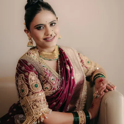 A tribute to the timeless beauty of the Maharashtrian bride. We curated a look that was bold yet soft, radiant yet rooted, bringing out her inner Maharani in a stunning Nauwari saree.
