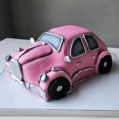 A vintage pink car, sculpted entirely from cake. This was a collaborative project where I got to bring this Barbie-est car to life.